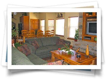 A living room with a couch and a television