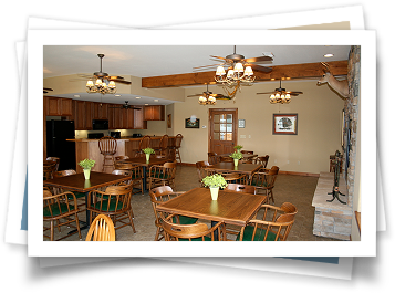 A dining room with tables and chairs and a fireplace