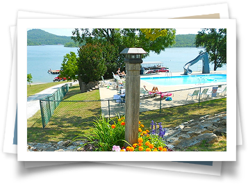 A picture of a swimming pool with a boat in the background