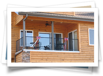 A picture of a wooden house with a balcony