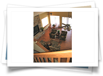 An aerial view of a living room with a fireplace