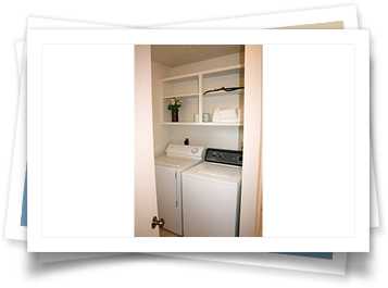 A picture of a laundry room with a washer and dryer