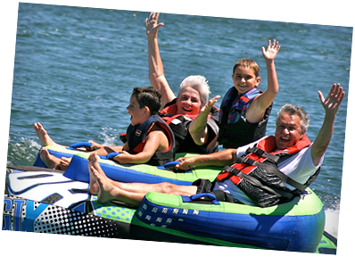 A group of people are floating on tubes in the water.