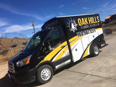 A black and yellow van is parked on the side of the road.