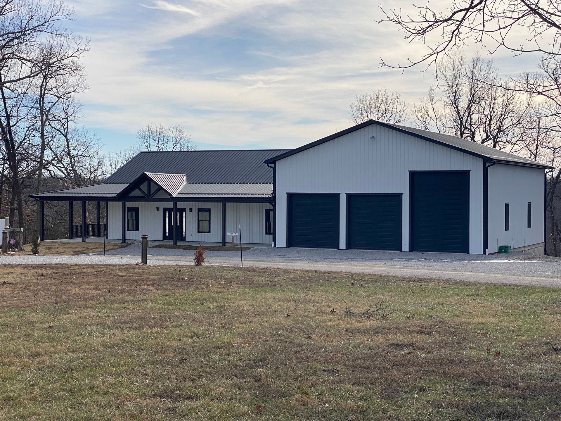 A Large White House with Big Garage Doors – Warsaw, Mo – Golden Rule Company
