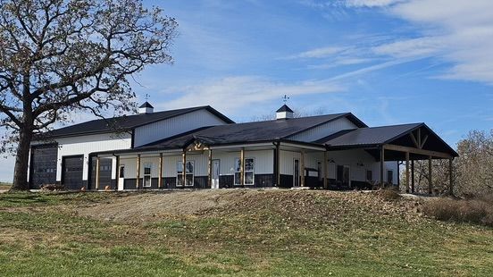 A Red And White Barn is Covered in Snow – Warsaw, Mo – Golden Rule Company