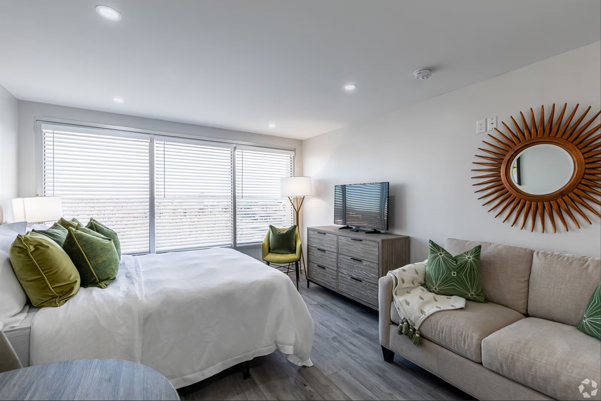 Furnished studio apartment bedroom and living area at The Millennium in downtown Hartford