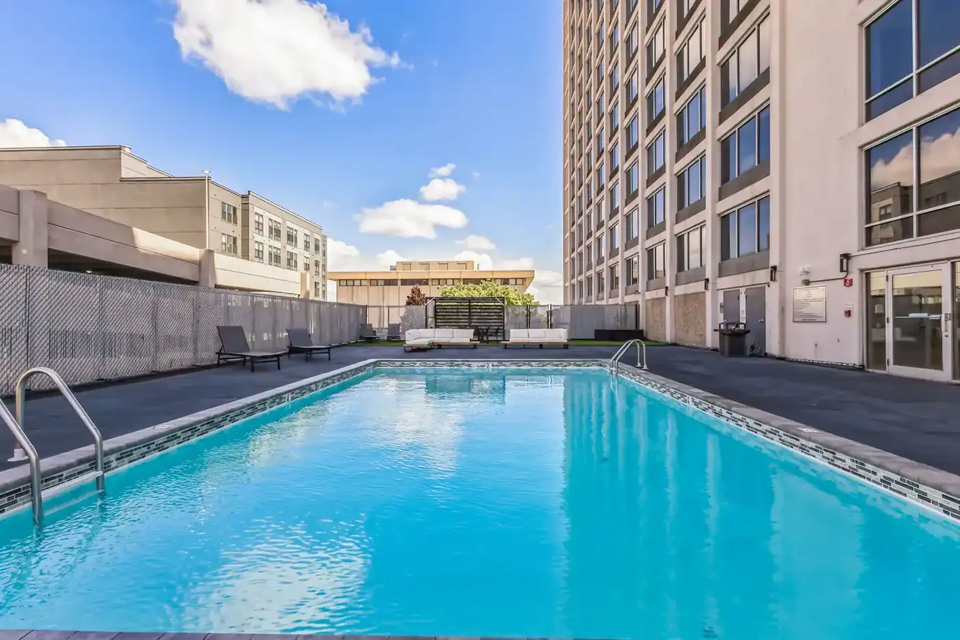 Outdoor swimming pool and sun deck at The Millennium luxury apartments in Hartford