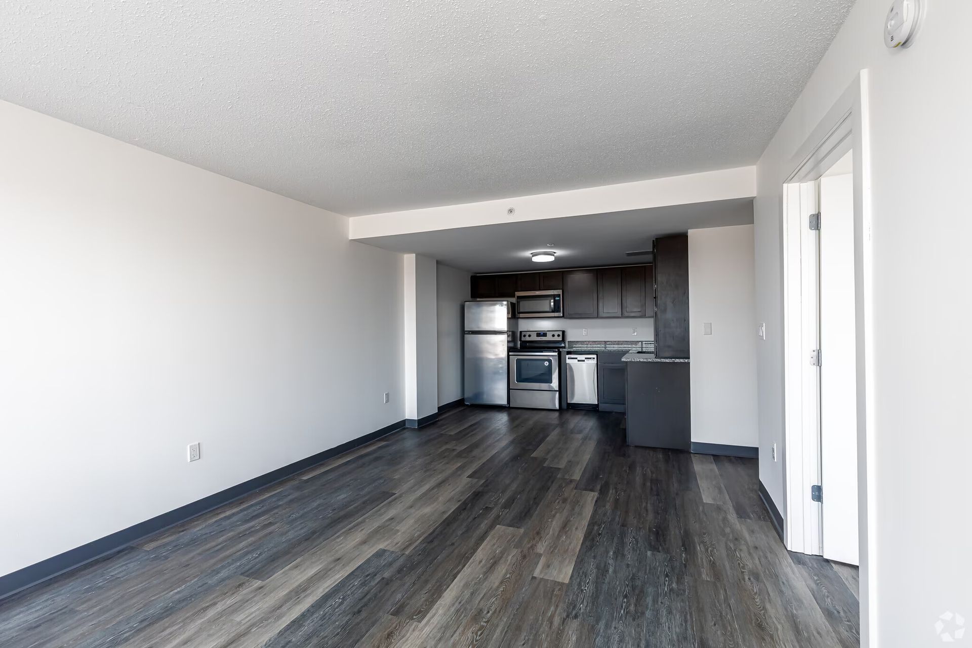Modern apartment kitchen with stainless steel appliances at The Millennium in Hartford