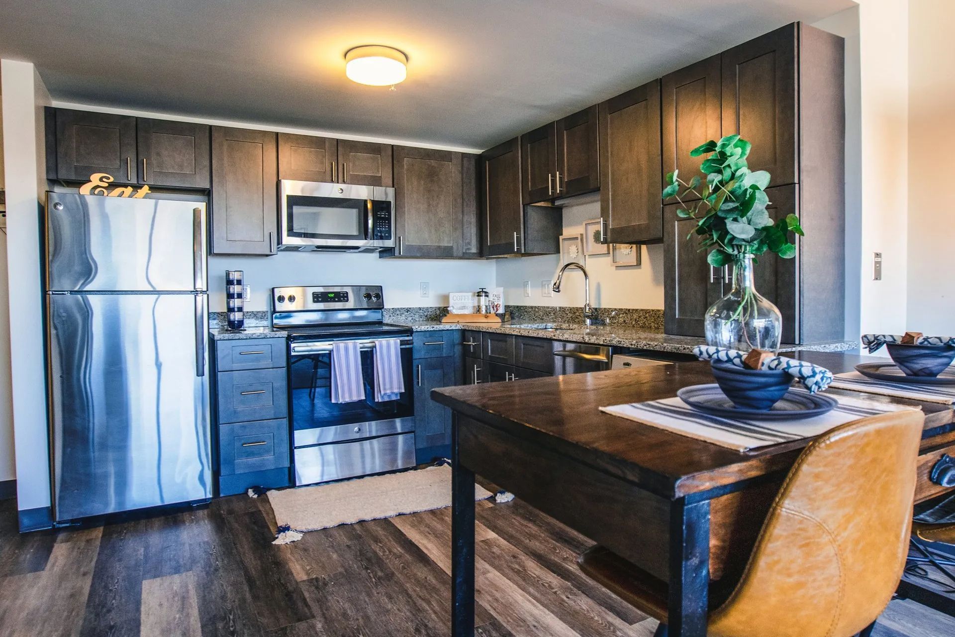 Modern apartment kitchen with stainless steel appliances at The Millennium in Hartford