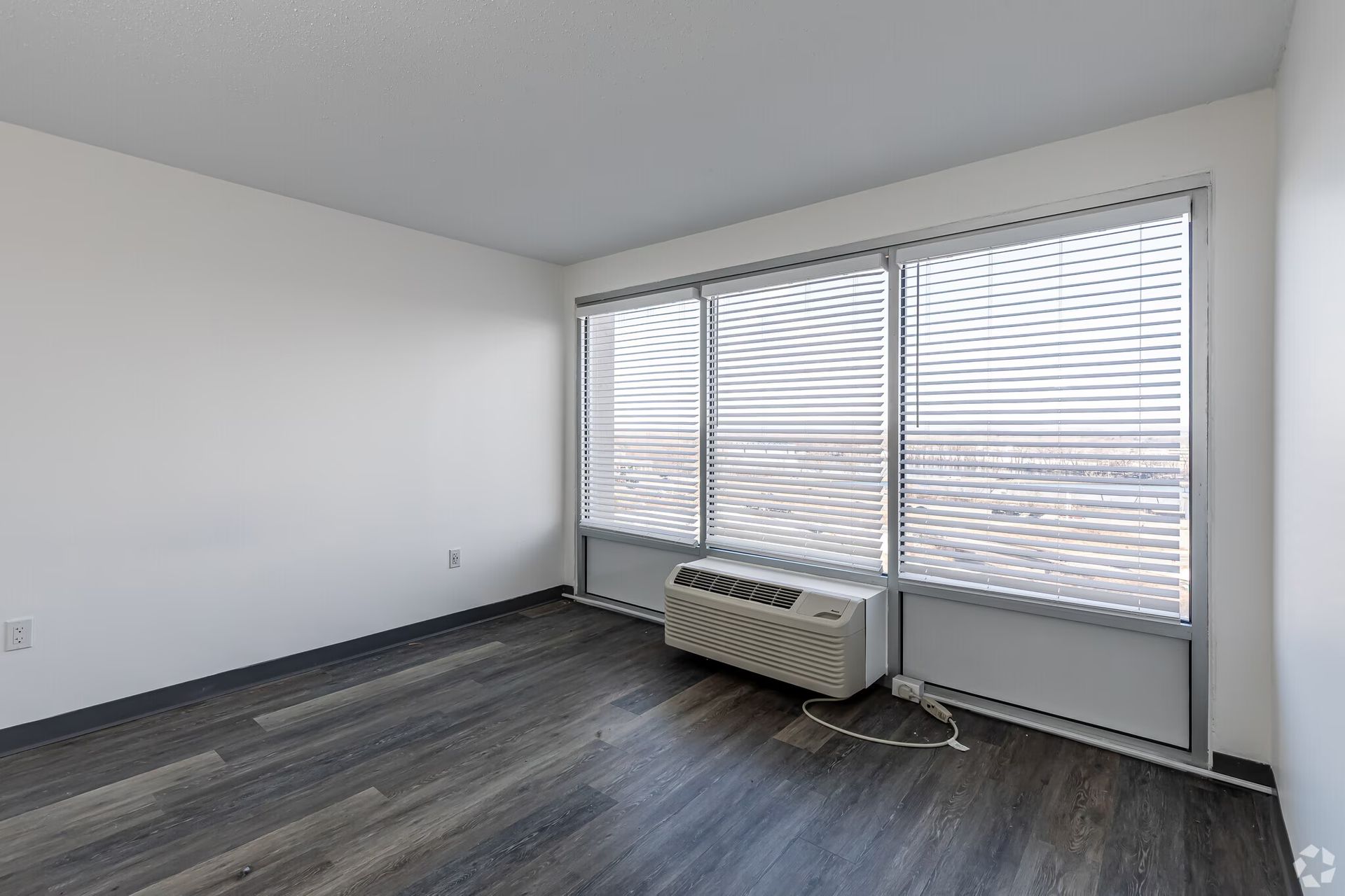 Bright unfurnished apartment room with large window at The Millennium Hartford