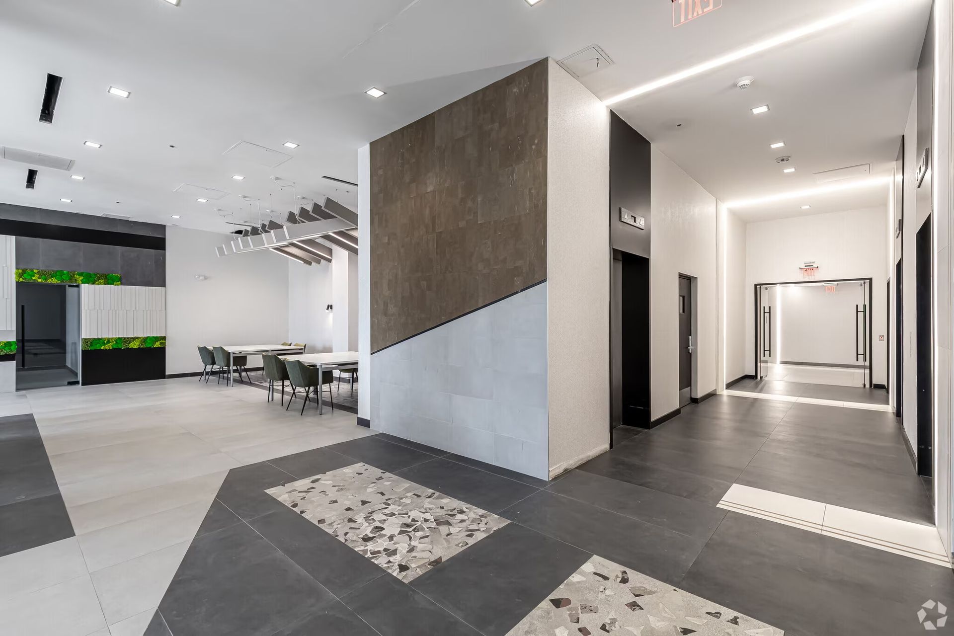 Modern apartment lobby with seating and elevator access at The Millennium in downtown Hartford
