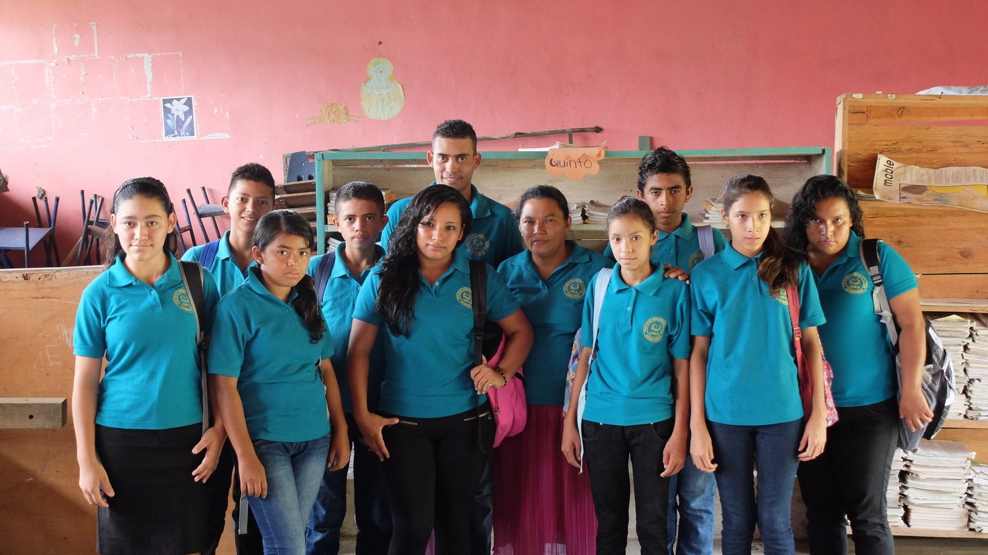A school photo of Honduran teenagers in a classroom.