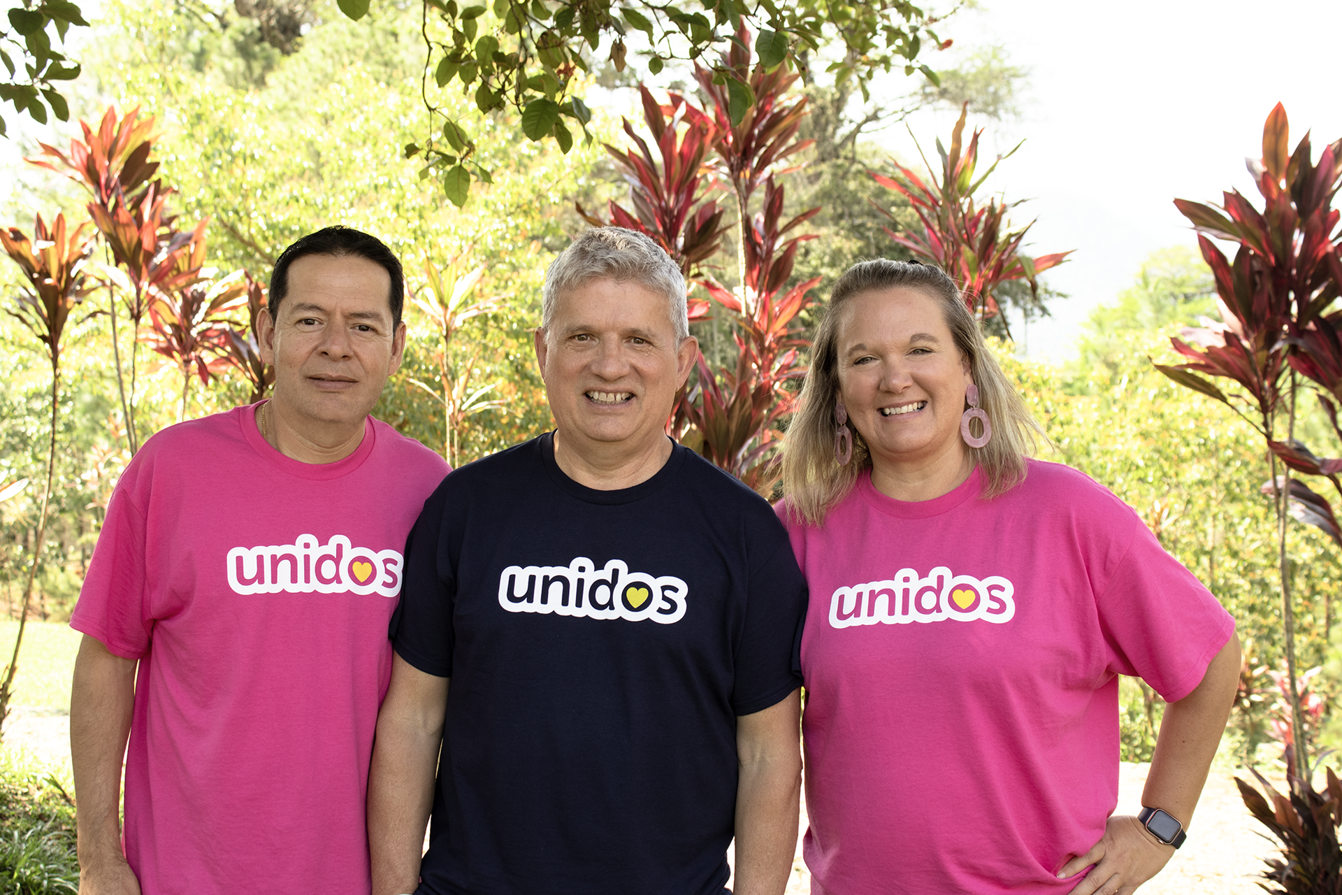 Staff and team members smile for the camera.