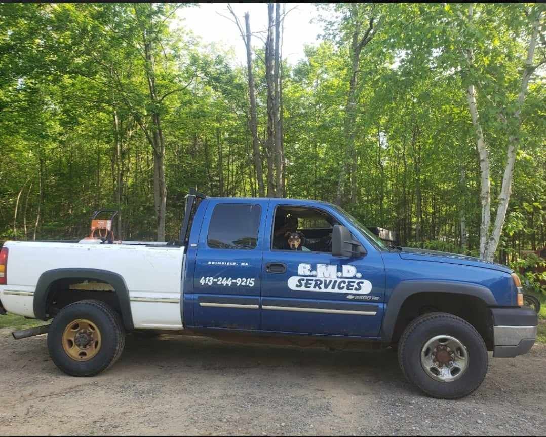 A Blue And White Truck With The Word Services On The Side — Brimfield, MA — RMD Services, Inc. A Blue And White Truck With The Word Services On The Side — Brimfield, MA — RMD Services, Inc.