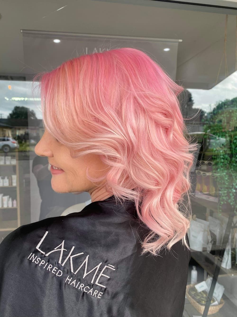 A Woman With Pink Hair Just Finished Getting Her Hair Done — Haelo Hair In Bomaderry, NSW