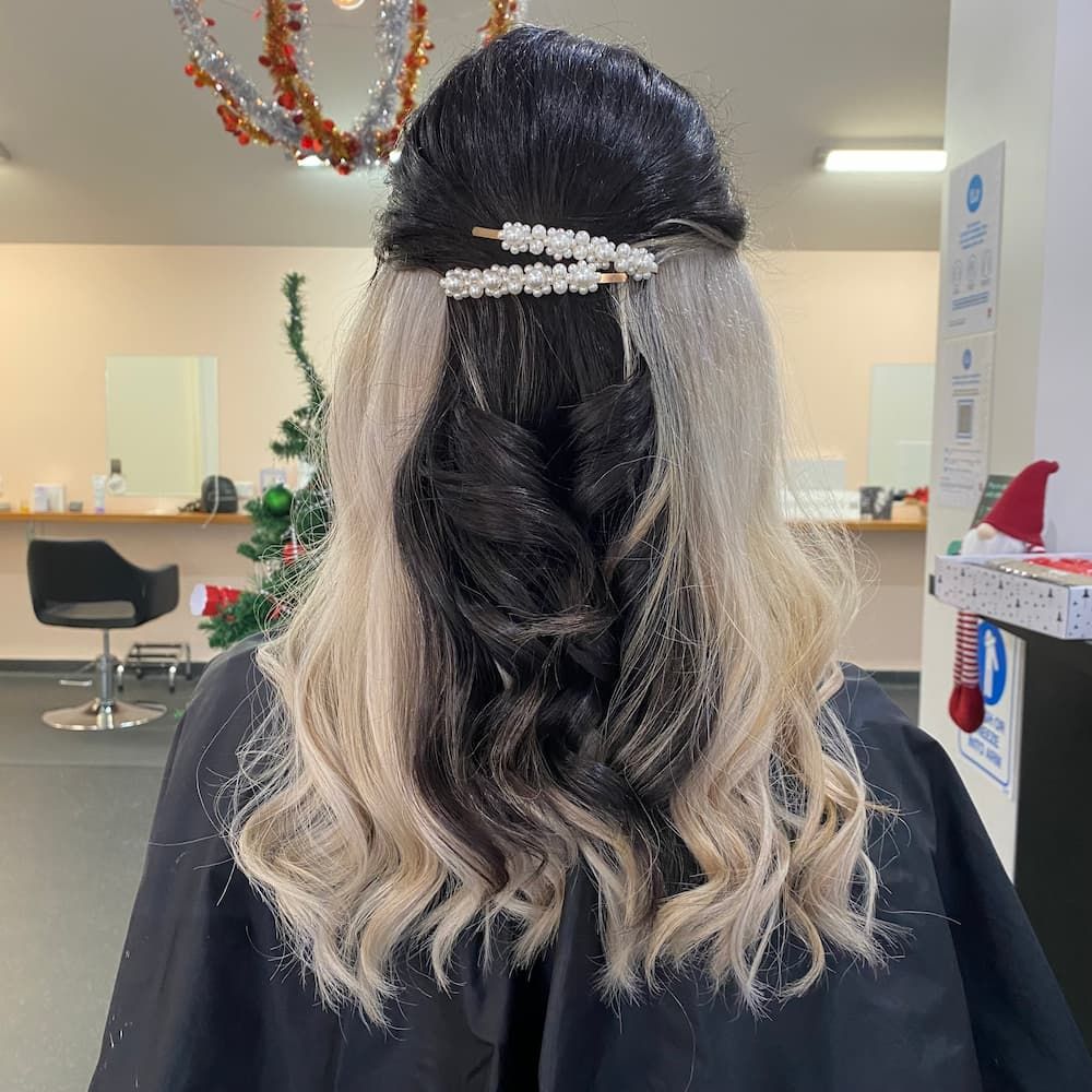 A Woman Is Getting Her Hair Done In A Salon — Haelo Hair In Bomaderry, NSW