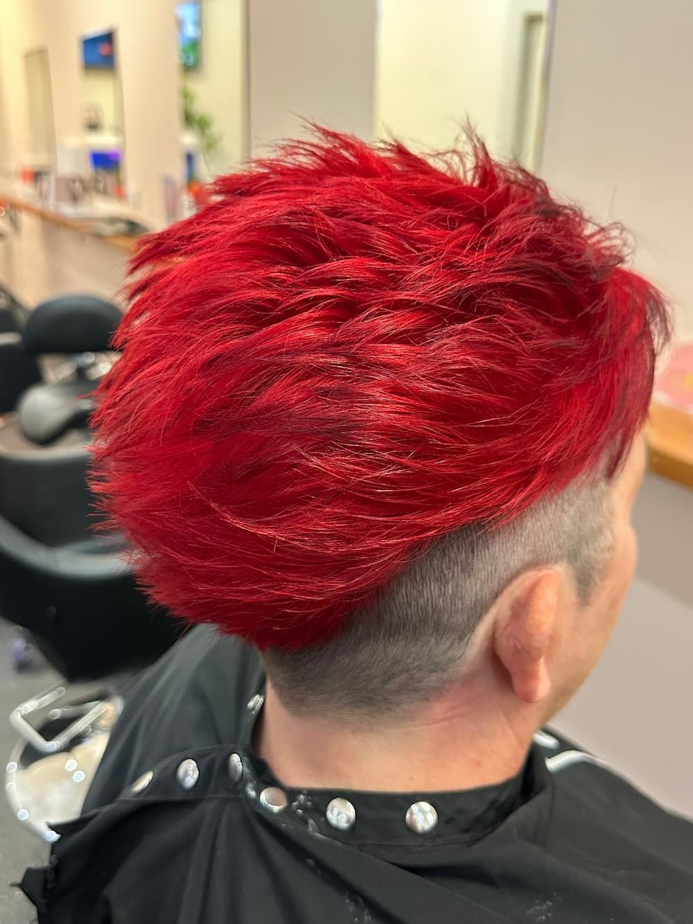 A Man With Red Hair Is Getting His Hair Cut In A Salon — Haelo Hair In Bomaderry, NSW