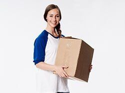 Woman with Cardboard Box — Self Storage in Reno, NV