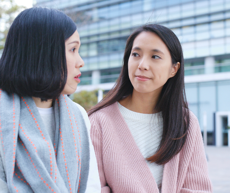 Two asian women conversing