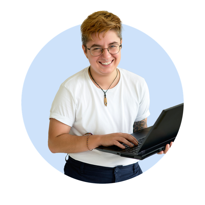 Transgender male holding laptop and smiling to camera