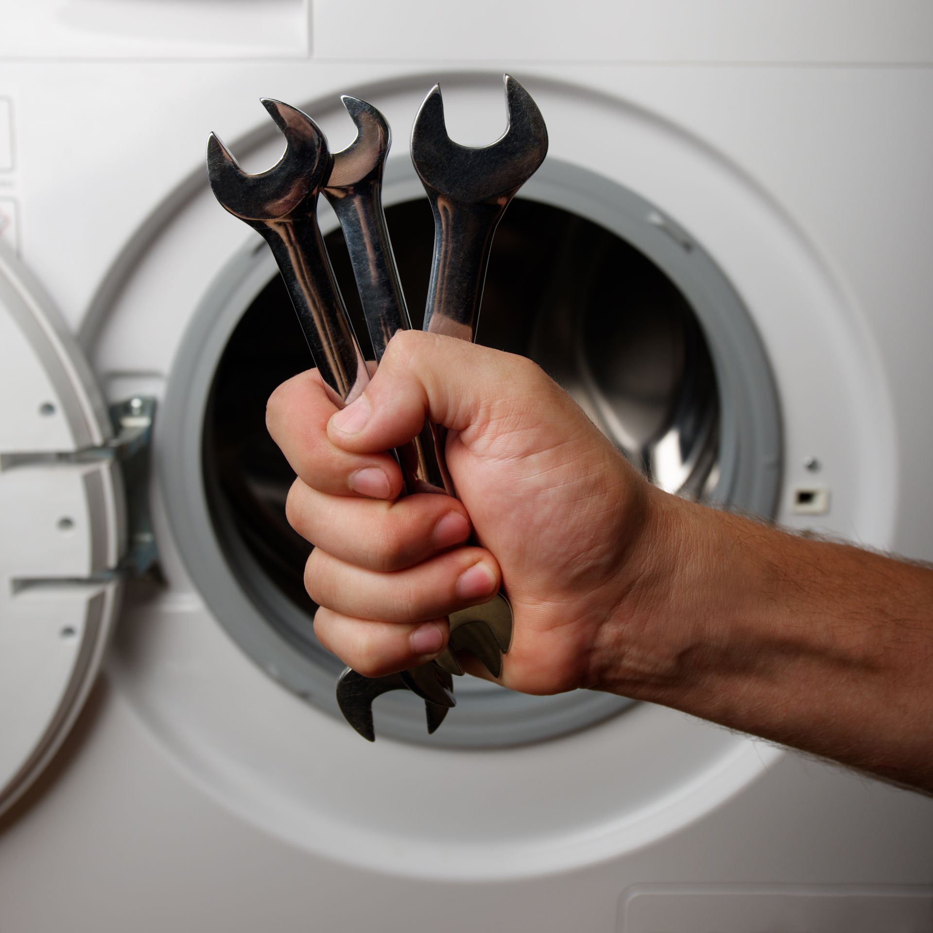 Technician Holding Wrenches