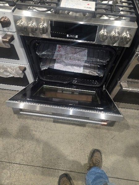 Open oven with stainless steel finish. 