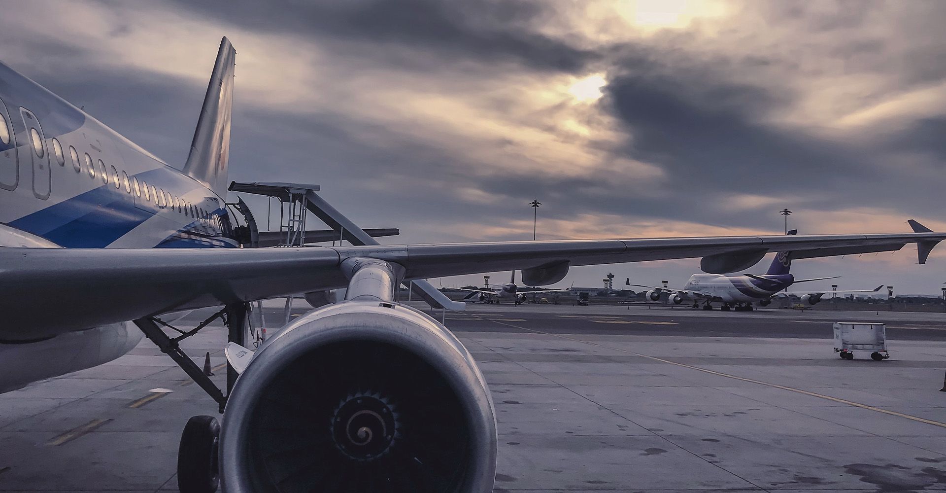 An airplane is parked on the tarmac at an airport.
