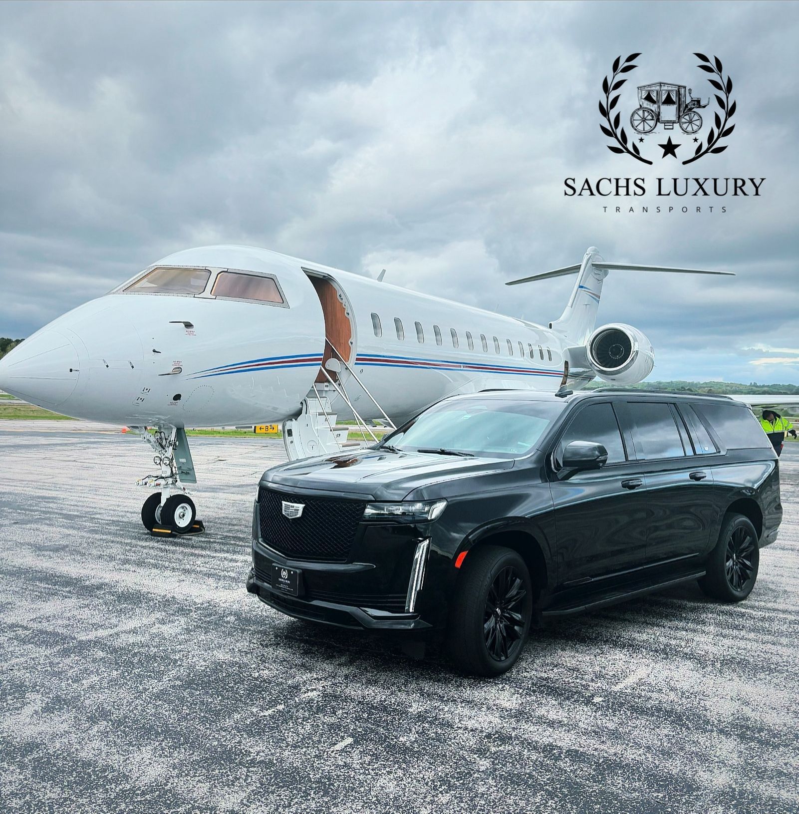 A black suv is parked in front of a private jet.