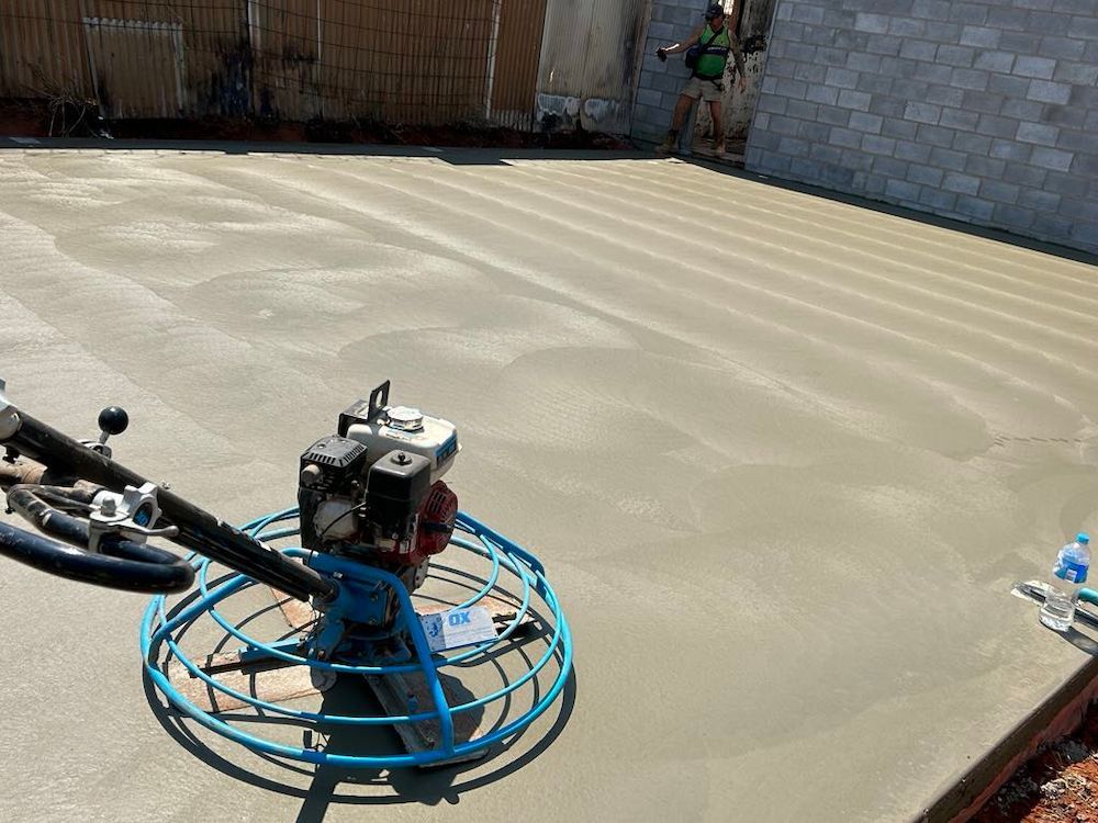 Concrete Slab Being Finished With a Power Trowel — Mobcon Construction in Katherine, NT
