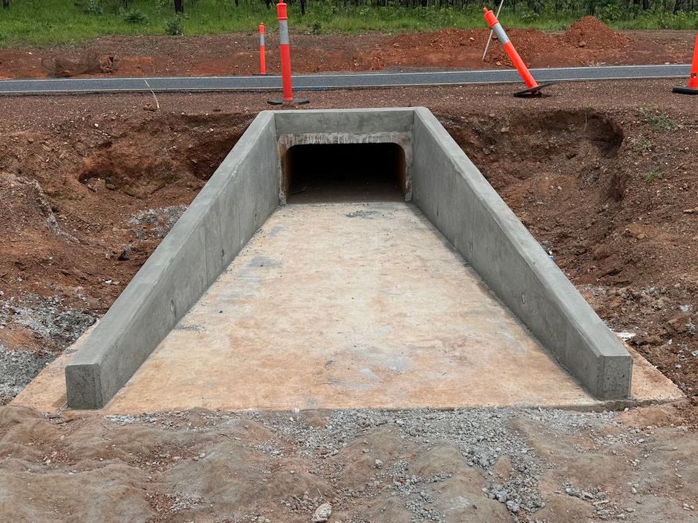 Concrete Culvert Under Construction, Surrounded by Dirt and Safety Cones — Mobcon Construction in Noonamah, NT