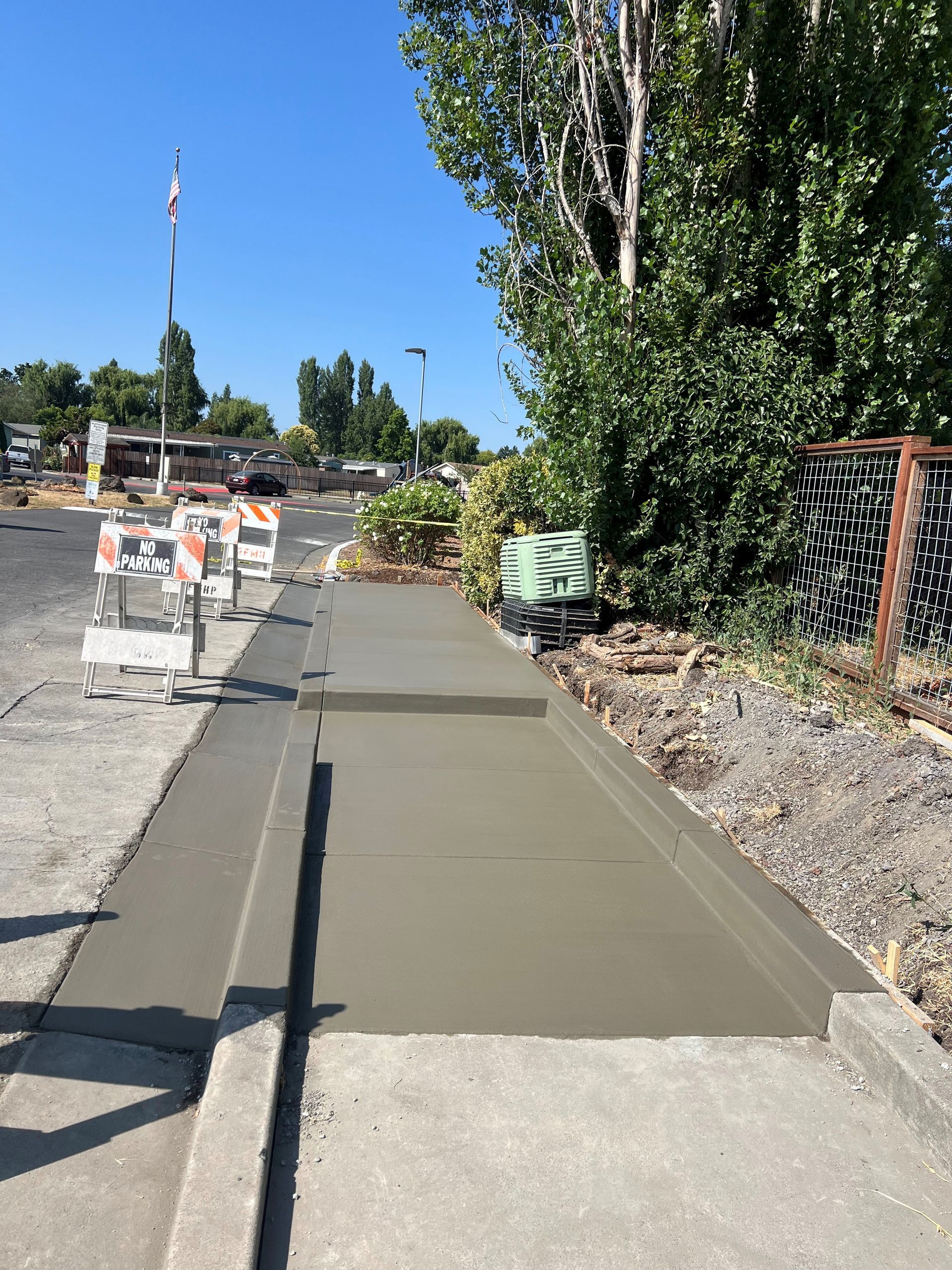 A man is installing a gutter on the roof of a house.