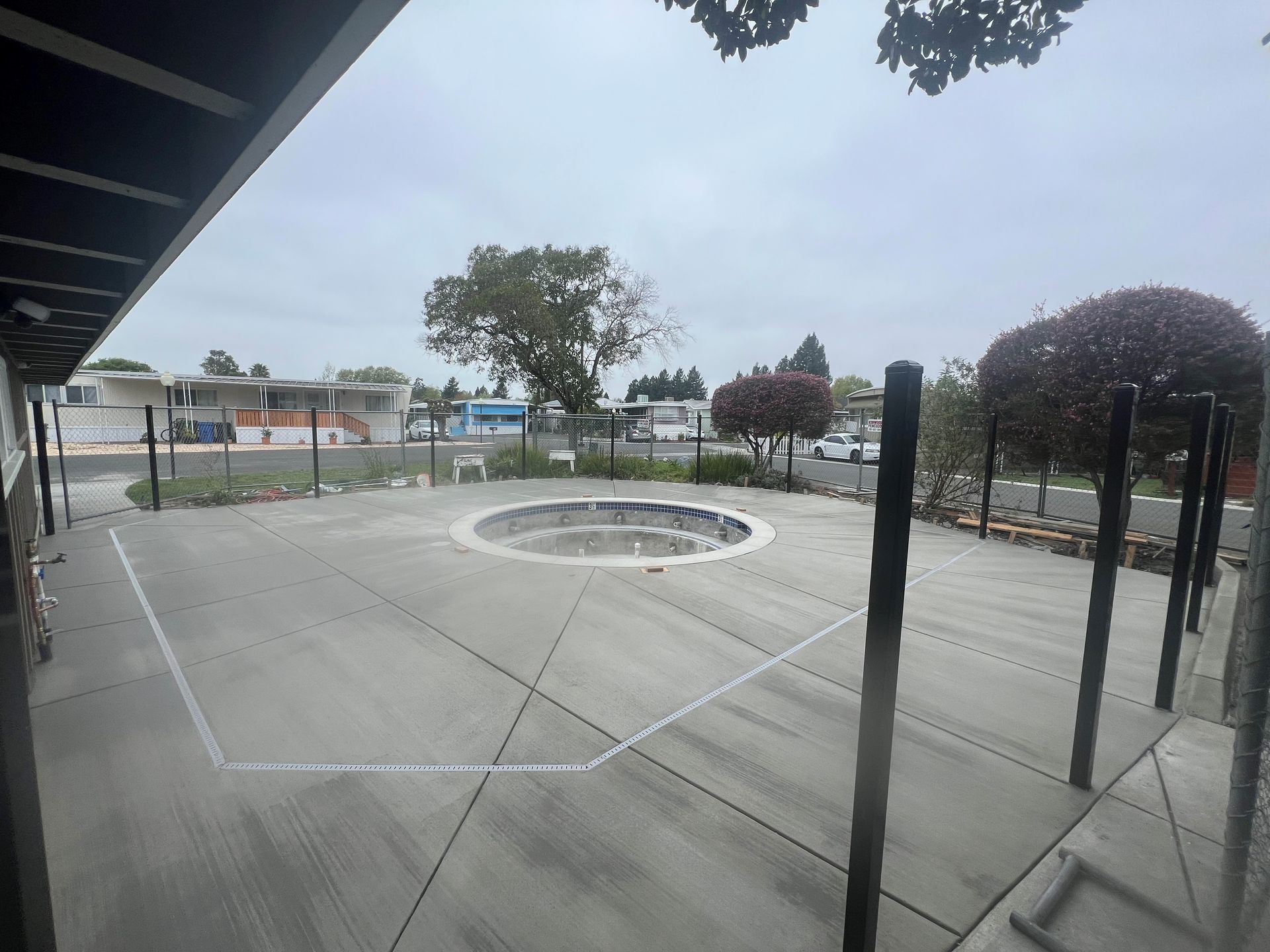 A concrete ramp is being built in front of a mobile home.