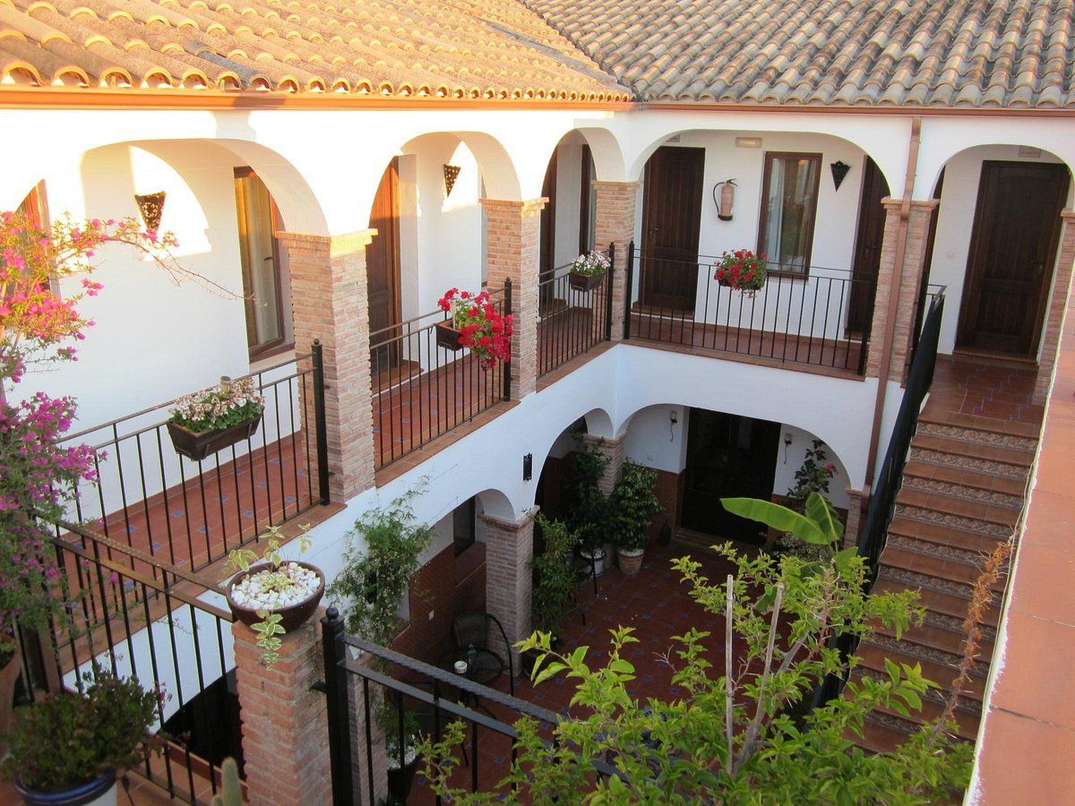 An aerial view of a building with balconies and stairs