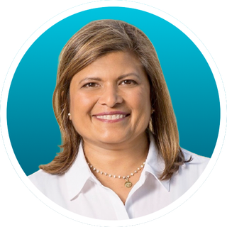 Smiling woman in a white blouse on a teal circular background