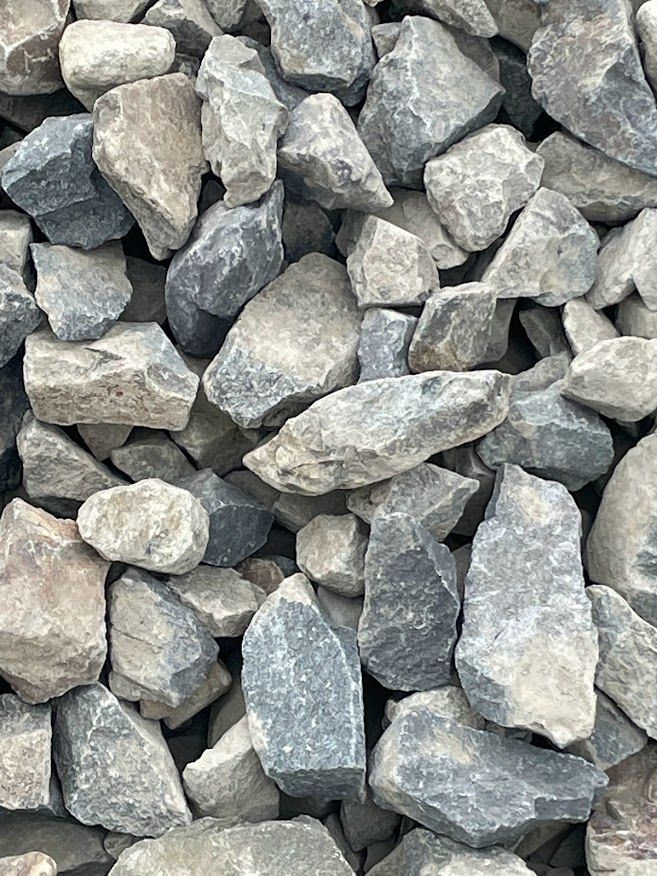 a pile of rocks that are gray and black