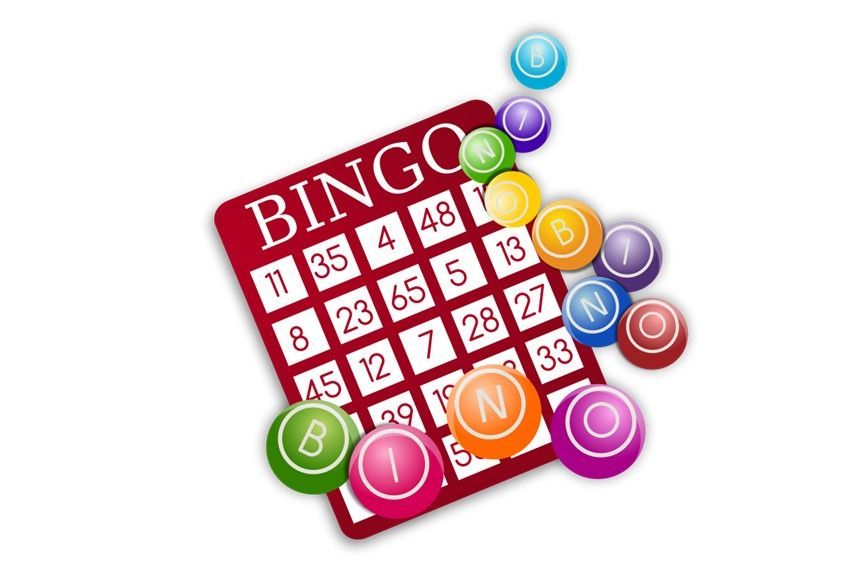 A bingo card with colored balls on top of it