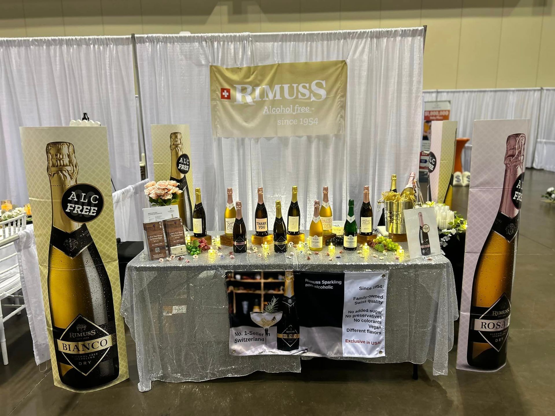 A table with a lot of bottles of champagne on it.