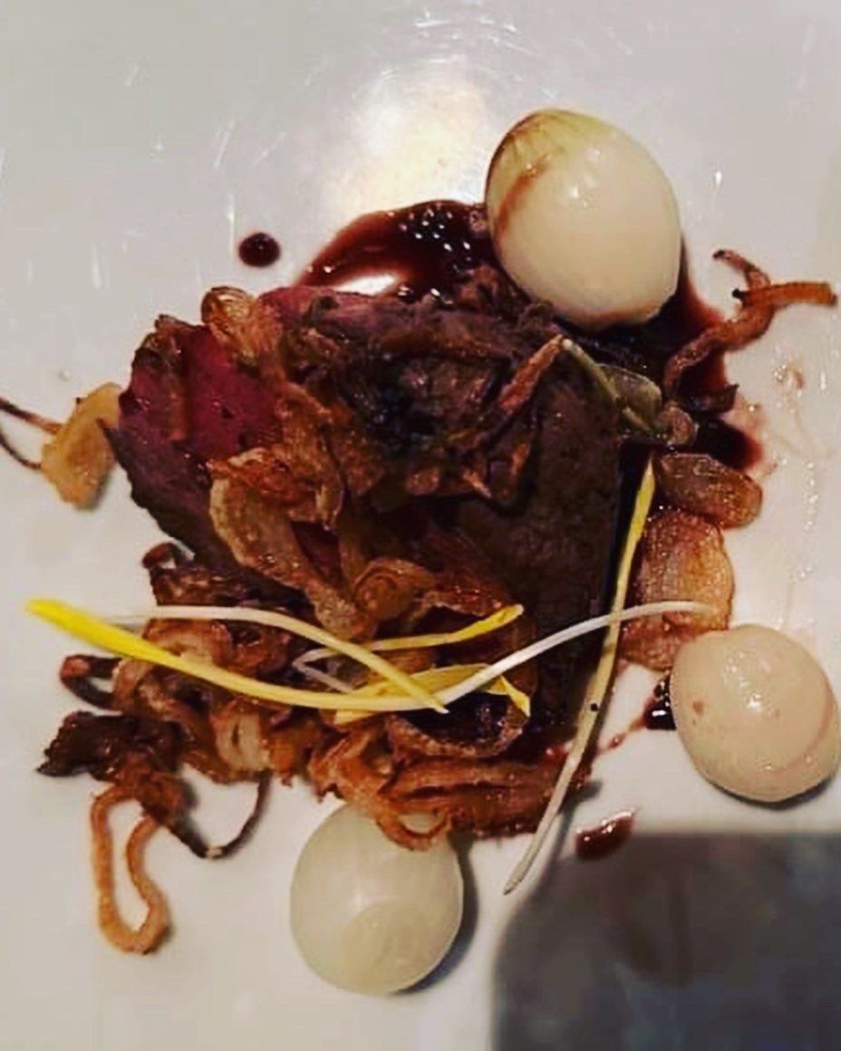 A close up of a plate of food on a table