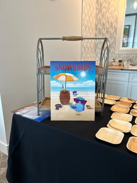 A table with a sign that says snow birds on it