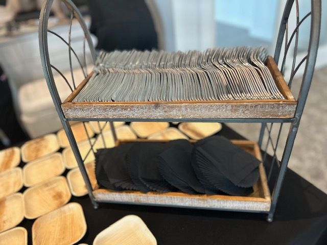 A tray of silverware is sitting on top of a table.