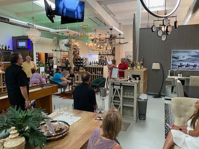 A group of people are sitting at tables in a room.