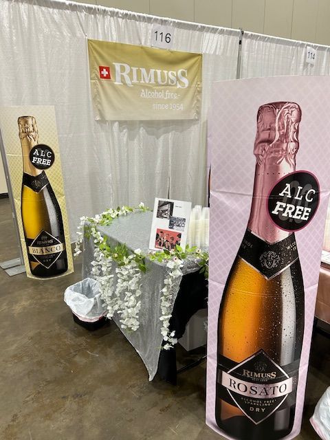 A table with a sign that says ' alc free ' on it