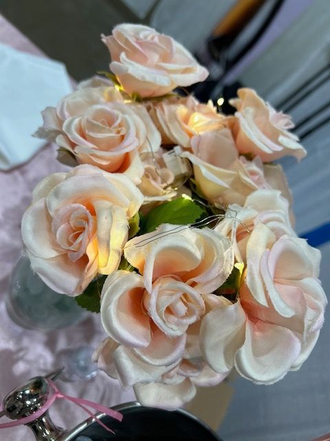 A bunch of pink roses in a glass vase