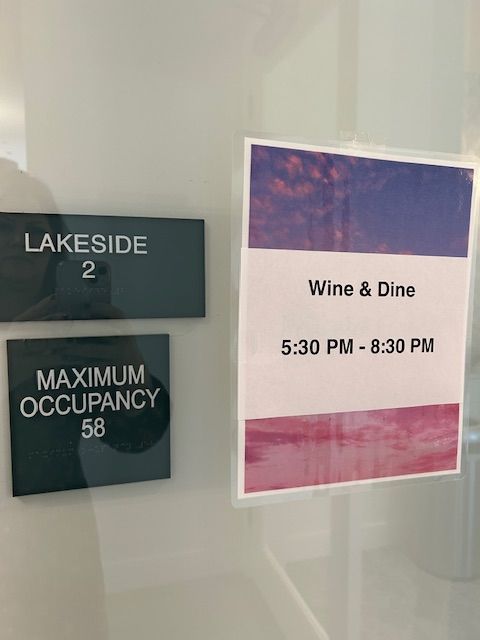 A sign that says wine and dine on it