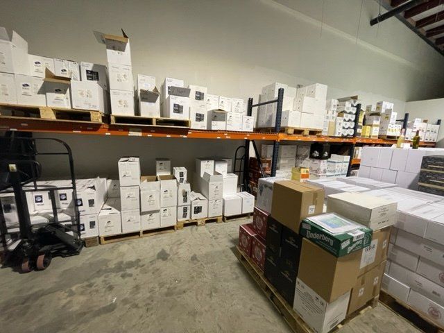 A warehouse filled with lots of boxes and pallets