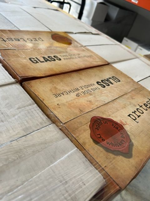 A wooden box with the word glass on it