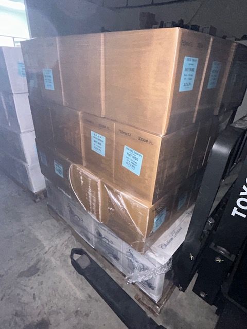 A bunch of boxes are stacked on top of each other on a pallet