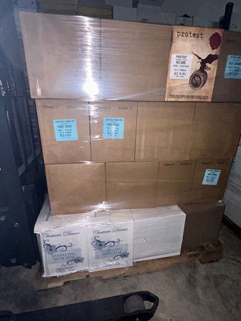 A stack of cardboard boxes with a sign that says protect