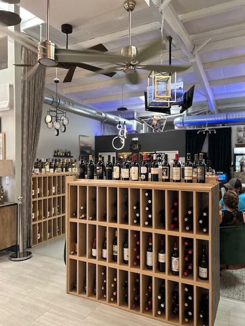 A shelf full of wine bottles in a store